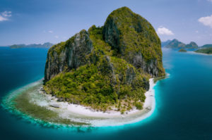 El Nido, Palawan, Philippines. Aerial drone above shot of impressive Pinagbuyutan Island. Amazing white sand Ipil beach with turquoise blue water around. El Nido, Palawan, Philippines. Aerial drone above shot of impressive Pinagbuyutan Island. Amazing white sand Ipil beach with turquoise blue water around.